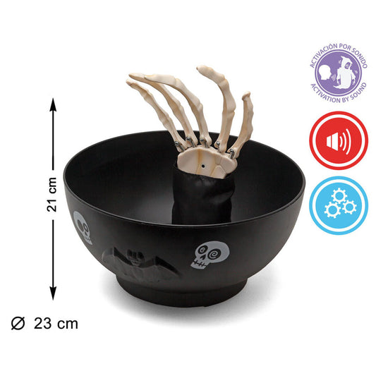 Godisskål med skelettarm som aktiveras av ljud. Bilden visar skålens höjd på 21 cm och diameter på 23 cm samt ikoner för ljud- och rörelsefunktioner.