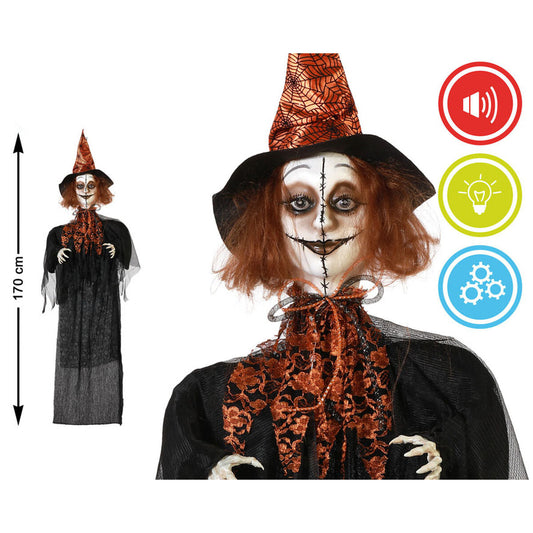 Hängande häxa 170 cm med vitmålat ansikte och svarta stygn. Orange hatt med spindelnätsmönster, svart klänning och funktioner för ljus, ljud och rörelse.