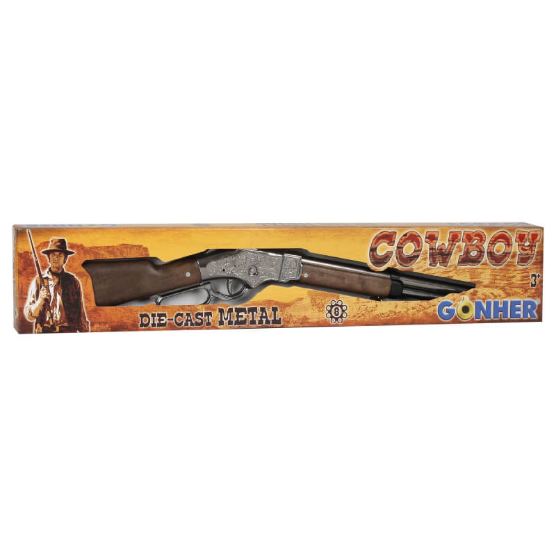 Ett klassiskt westerngevär i metall och träimitation, presenterat i sin "Cowboy" tematiserade förpackning med texten "Die-Cast Metal".