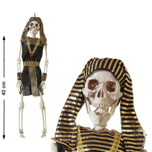 Ett kusligt, hängande Farao-skelett klätt i en egyptisk dräkt, som visar dess längd på 40 cm och en närbild på dödskallen.
