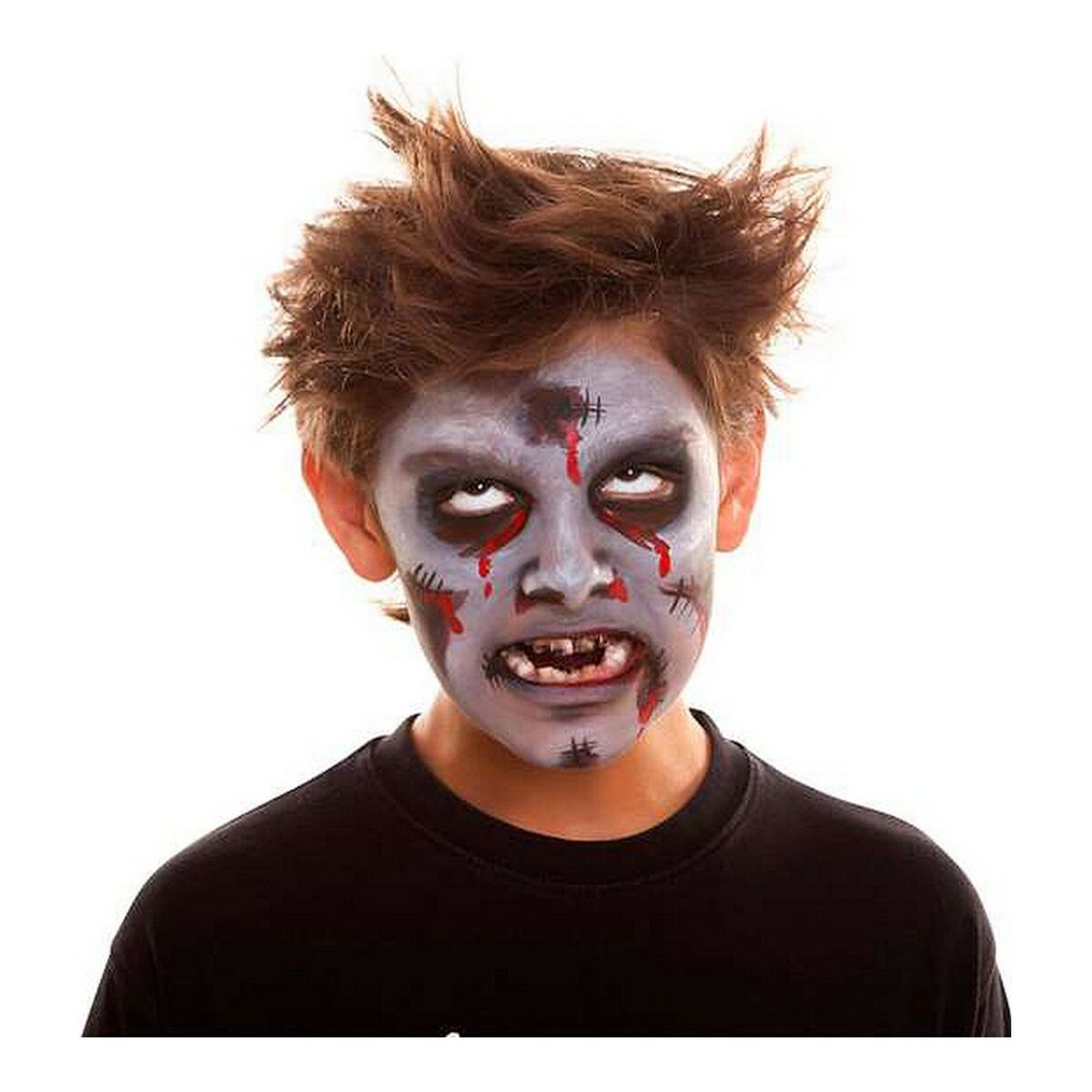 En pojke med en komplett och läskig zombie-ansiktsmålning med fejk-sår och blod.