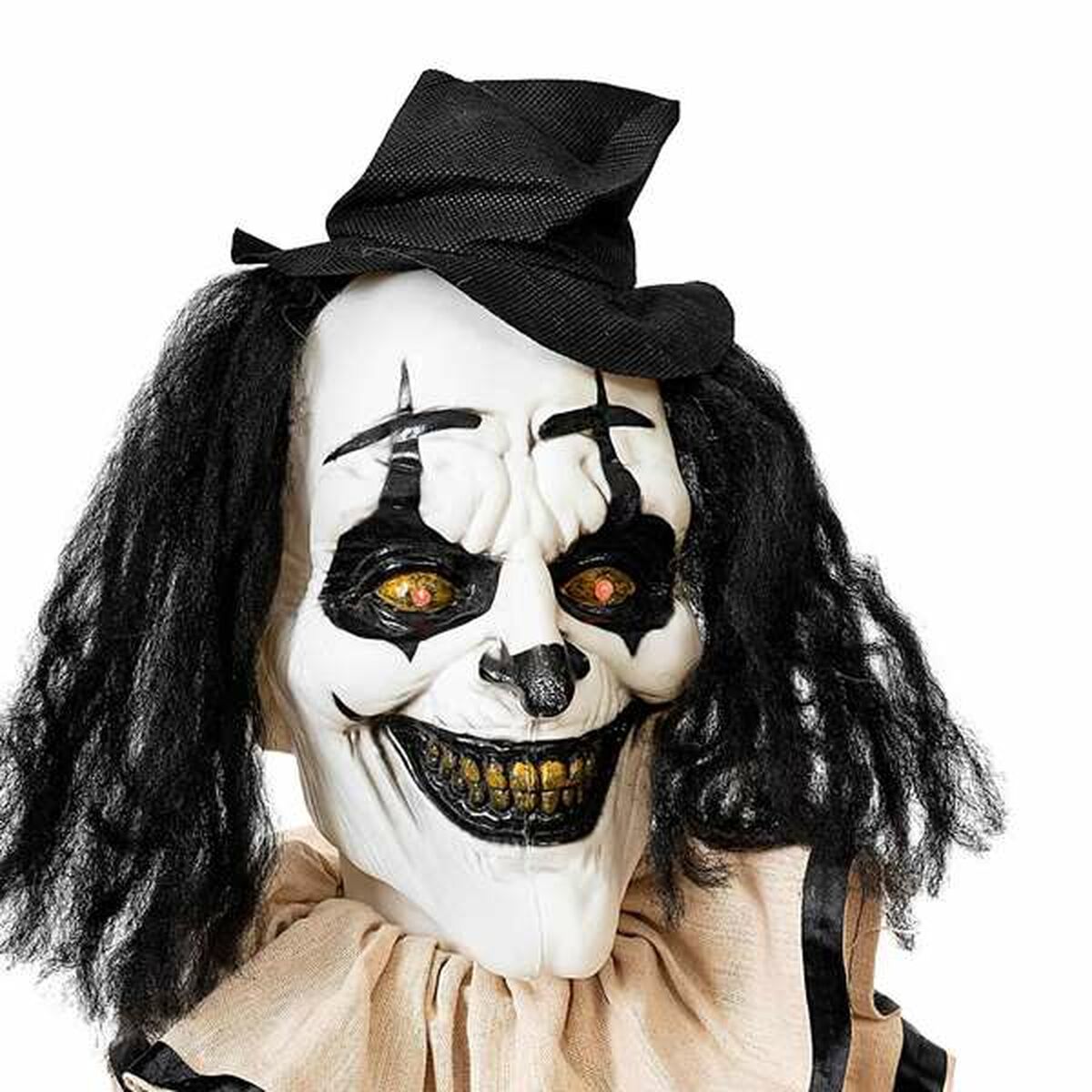 En extrem närbild på den stående clownens ansikte, som fokuserar på de hotfulla, lysande gula ögonen och de ruttna tänderna.