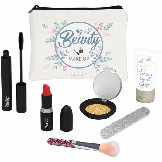 Ett sminkset för barn som innehåller en vit necessär med texten 'my Beauty MAKE UP', en röd läppstift, en mascara, en palett med guldig ögonskugga och spegel, en silverfärgad nagelfil och en sminkborste med glitterhandtag.