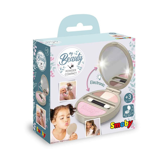 En grå och rosa leksakspuderdosa för barn med texten 'My Beauty Powder Compact' som visar att den har inbyggt LED-ljus och rekommenderas från 3 år.