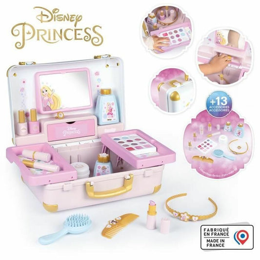Öppen ljusrosa resväska med Disney Princess-tema, fylld med leksakssmink, nagellack, en spegel och tillbehör som kam, borste och ett halsband.