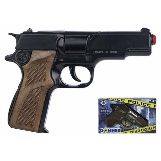 Närbild på en svart leksakspistol med brunt, texturerat handtag, designad som en polisrevolver, med en liten kartongförpackning märkt "Police" och "Do Not Cross Line".