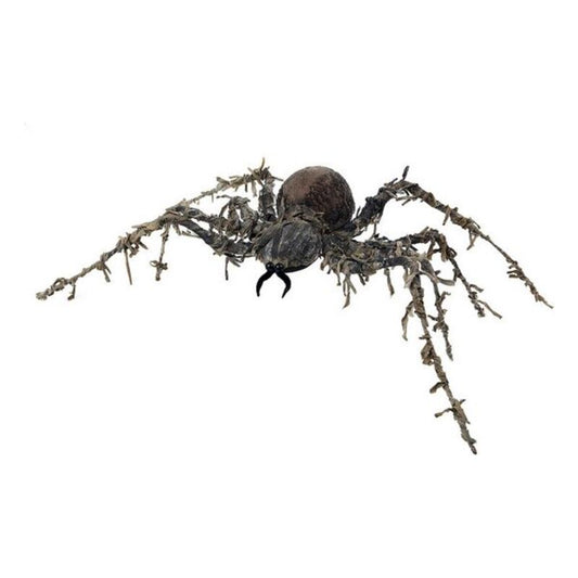 En stor, brunsvart dekoration av en spindel med fluffig kropp och långa, trådiga, taggiga ben, redo att skrämma på Halloween.