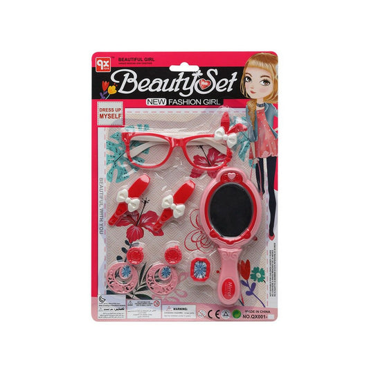Ett rött och rosa leksaksset märkt 'Beauty Set' som innehåller plastglasögon, örhängen, en ring och en handhållen spegel, förpackat på en bakgrund med en tecknad flicka.