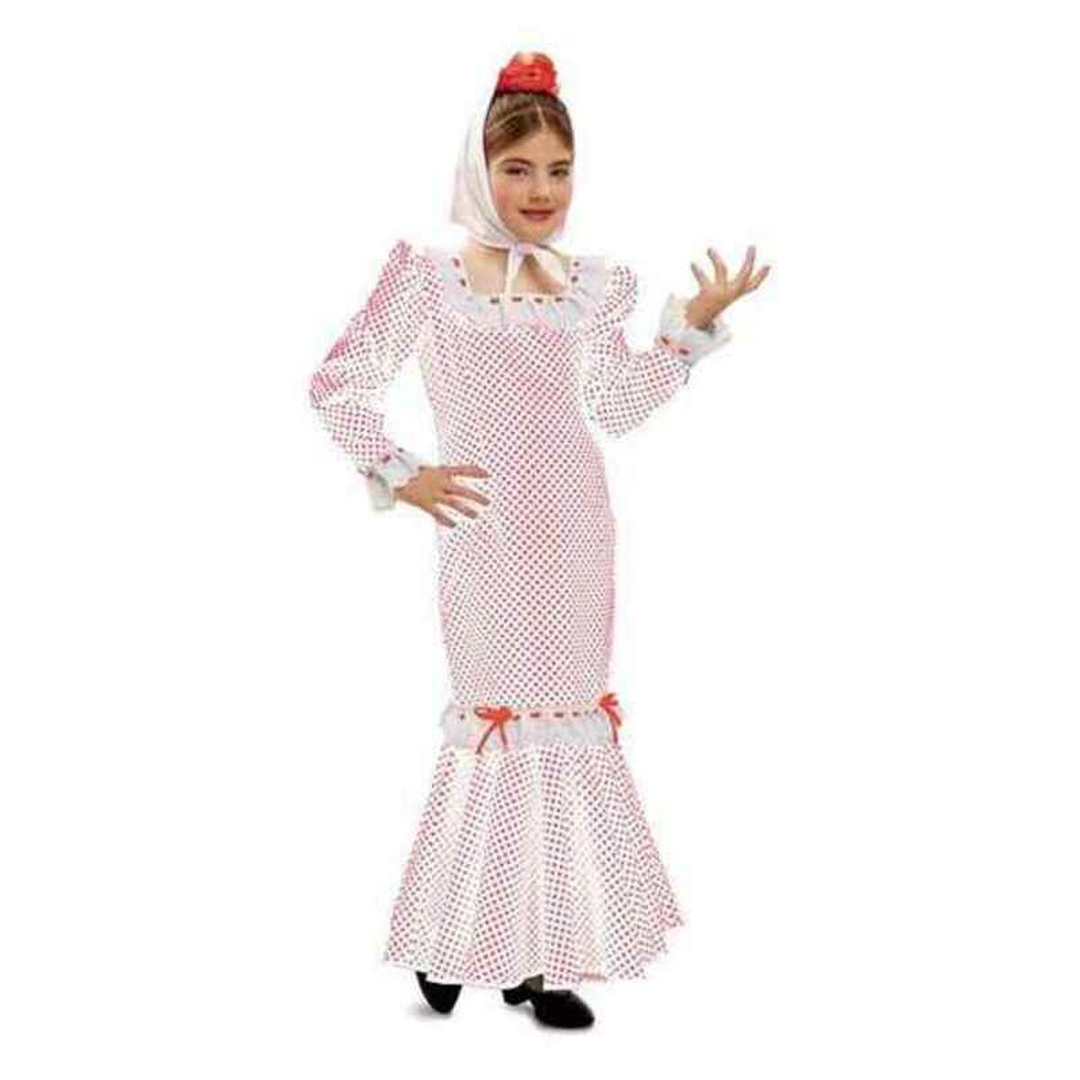 Ett barn poserar i en vit och rödprickig långärmad Flamenco-inspirerad maskeraddräkt med en vit sjal knuten runt huvudet.