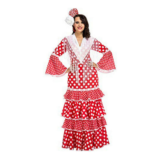 En kvinna poserar i en röd och vit prickig Flamenca-maskeraddräkt med volanger, vida ärmar och en vit sjal med vita fransar över axlarna.