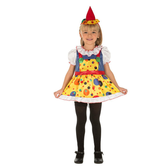 Ett glatt litet barn klädd i en färgglad kvinnlig clownmaskeraddräkt med gul prickig klänning och en liten röd konformad hatt.