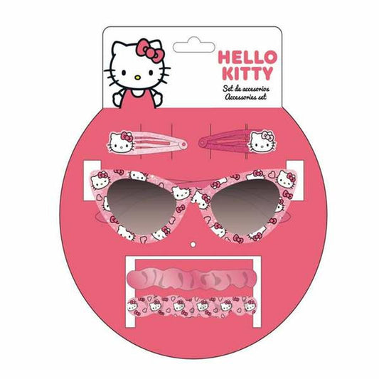 Ett rosa set med Hello Kitty accessoarer för barn, inklusive ett par kattögonformade solglasögon, två hårklämmor och ett mönstrat resårband, förpackade på en rosa display.