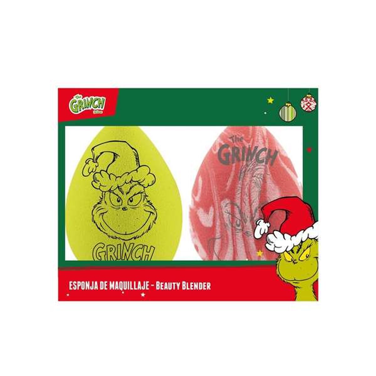 En förpackning med två sminksvampar med Grinch-tema, en är grön med Grinchs ansikte och den andra är röd och vit.