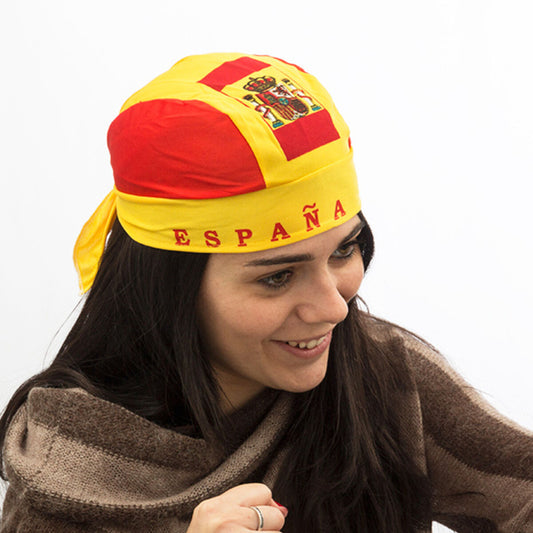 Kvinna med spansk bandana i rött och gult, texten "España" framtill och vapenmotiv på ovansidan.