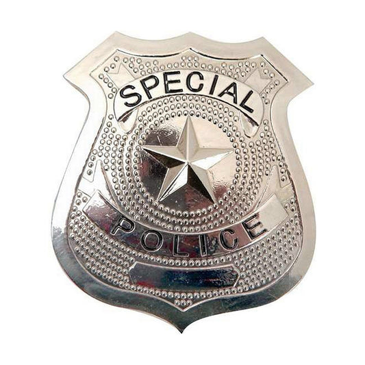 En blank, silverfärgad polisbricka med en stjärna i mitten och texten "Special Police".
