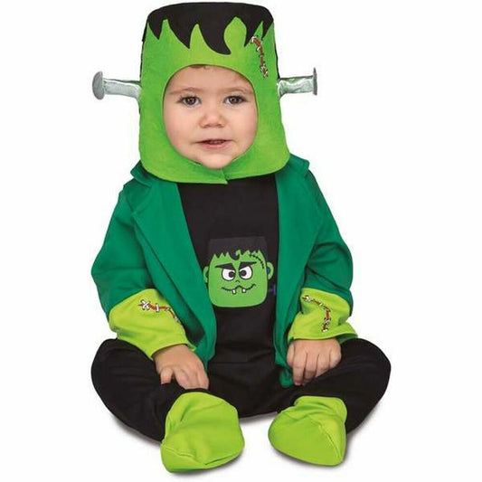 Bebis i grön och svart Frankenstein-inspirerad maskeraddräkt med tryckt monsteransikte på magen och bultdetaljer vid huvudet, sittandes på golvet.
