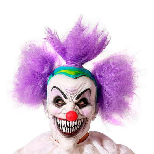 En person bär en skräckinjagande clownmask med stort leende, vit latexhud och stort lila hår – perfekt för halloween.