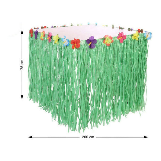 En grön hawaiikjol för bord med färgglada blommor längs kanten, visad både i förpackning och upphängd runt ett bord, perfekt för temafest eller sommarbuffé.