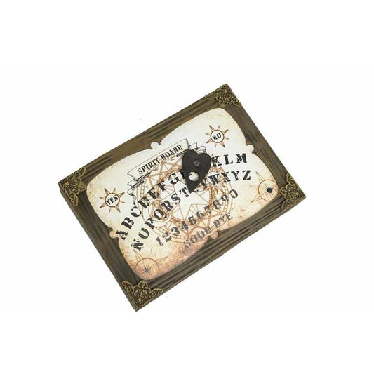 Ett hemsökt och väderbitet Ouija-bräde / Anden i Glaset med en planchatt och dekorerade hörn, redo för en seans.