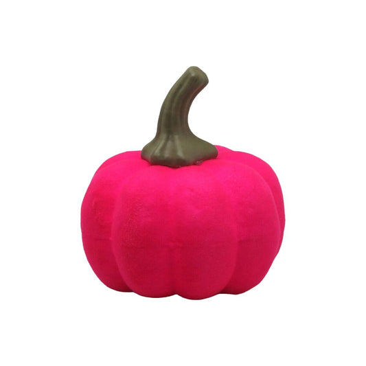 En liten, kaxig pumpa i neonrosa färg med en mörkgrön stjälk.
