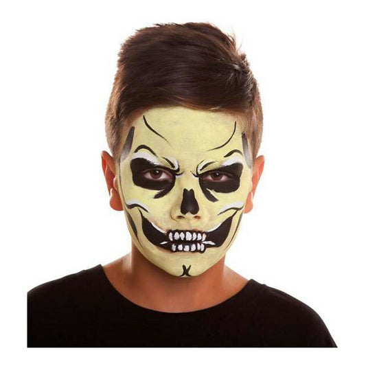 Ett barn med en cool och välgjord dödskallesminkning i gult och svart, redo för Halloween.