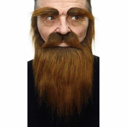 En man som bär ett tjockt, långt brunt lösskägg, mustasch och tjocka ögonbryn.