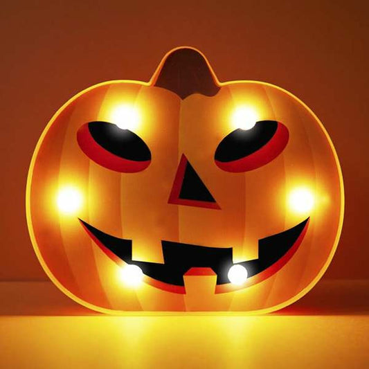 En orange, Lysande Jack-o'-Lantern LED-Dekoration med ett utskuret ansikte som glöder med ett varmt, gult sken.