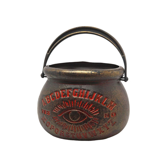 En ockult, bronsfärgad häxkittel med ett Ouija-mönster i rött och ett allseende öga.