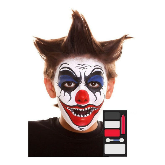 En pojke med en komplett och ondskefull clown-ansiktsmålning med målade vassa tänder.