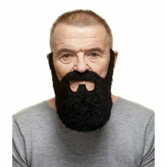  En man bär ett stort, tjockt och välansat kolsvart lösskägg med en matchande mustasch, vilket ger honom ett respektingivande utseende som en skogshuggare eller biker.