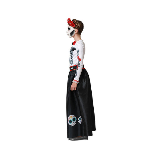 Sidan av ett barn som bär den eleganta Day of the Dead-dräkten, som visar skelettrycket på armen.